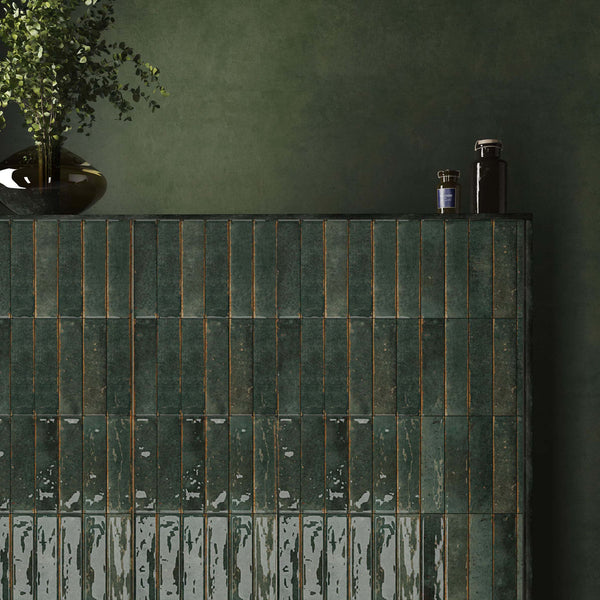 Front view of vertically stacked deep green glazed ceramic tiles