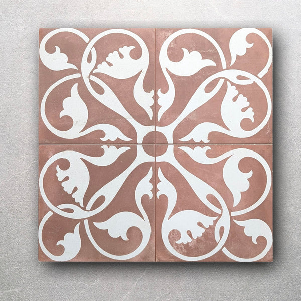 Front view of artisan floral swirl tile in terracotta and white