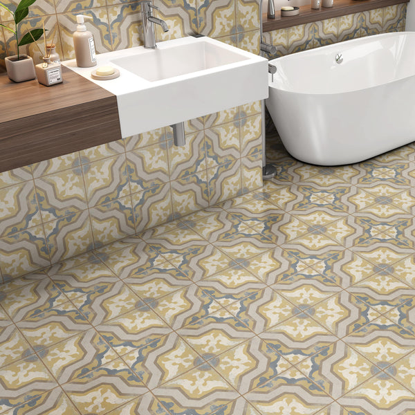 Interior bathroom space with yellow and blue patterned heritage tile on floor or wall