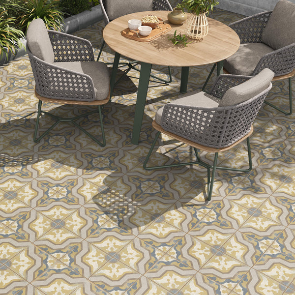 outdoor patio space with yellow and blue patterned heritage tile on floor or wall